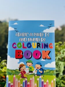 Child-friendly Arabic alphabets and numbers colouring book cover with cartoon kids and pencils