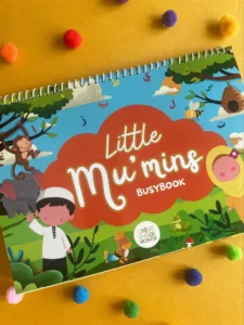 Little Mu'mins Busy Book cover, an engaging Islamic learning activity book for children with vibrant illustrations of a boy, girl, monkey, elephant, and Arabic letters.